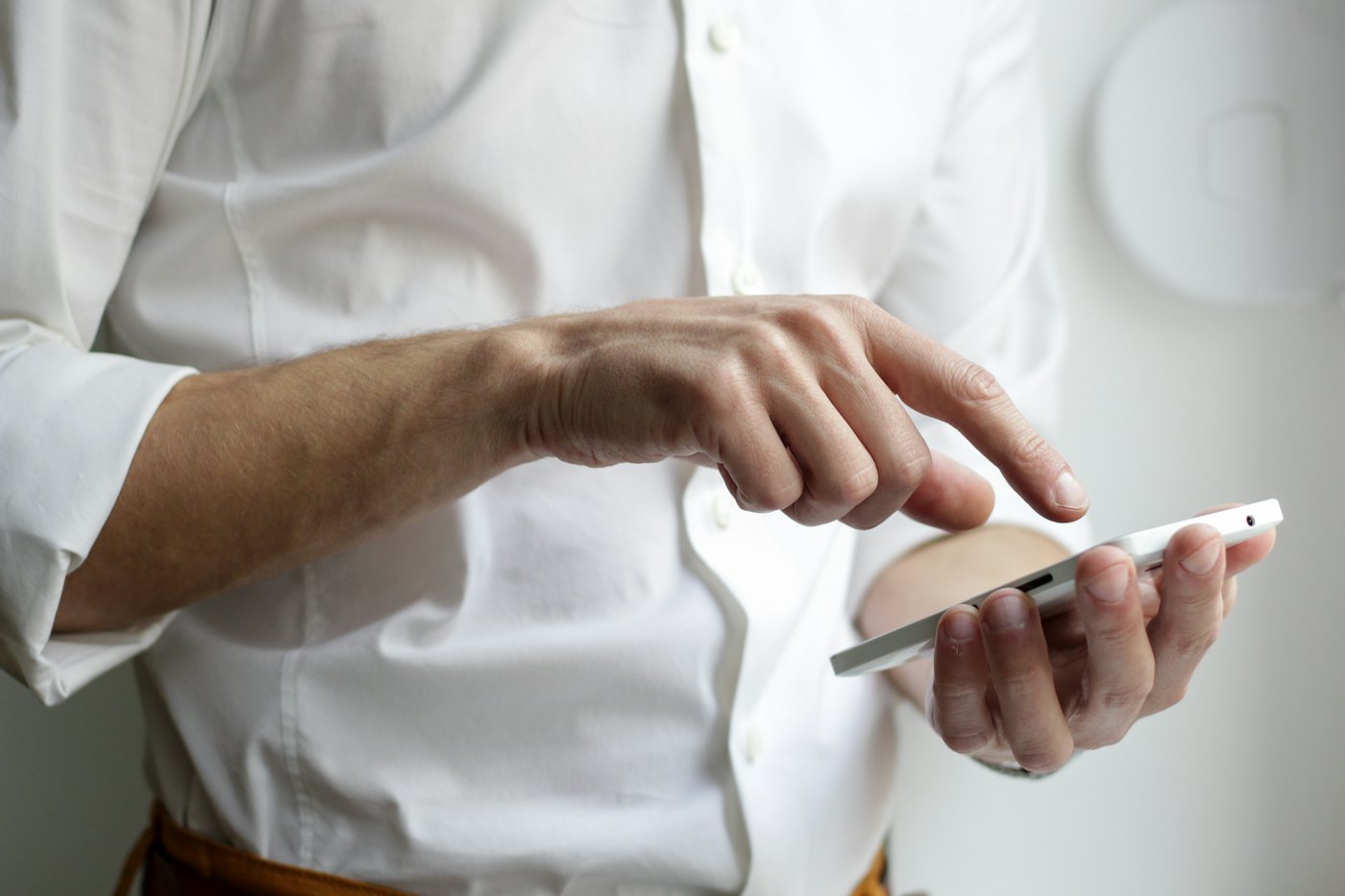 A person holding a phone with both hands
